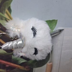 Claire’s glitter fur unicorn keychain with pen
